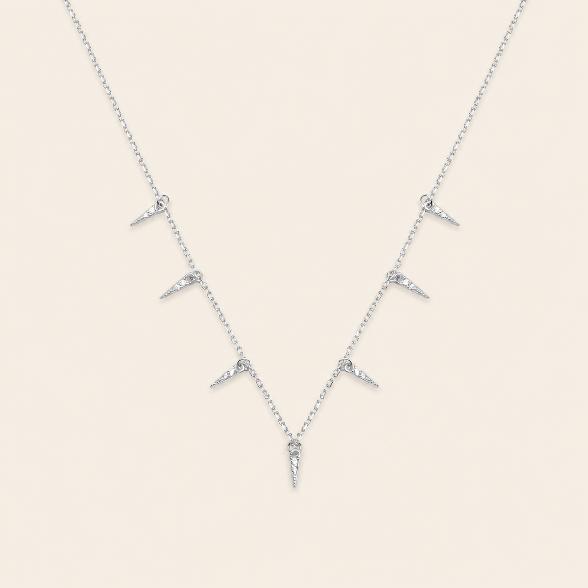 Fine Trace Necklace with a fine chain with small tapered drops in silver finish