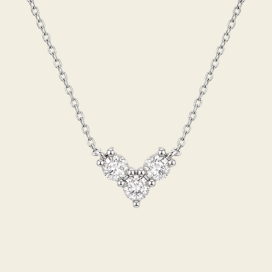 Fine Trio Necklace with a small triangular cluster of clear stones in silver finish