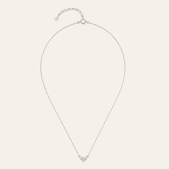 Fine Trio Necklace with a small triangular cluster of clear stones in silver finish