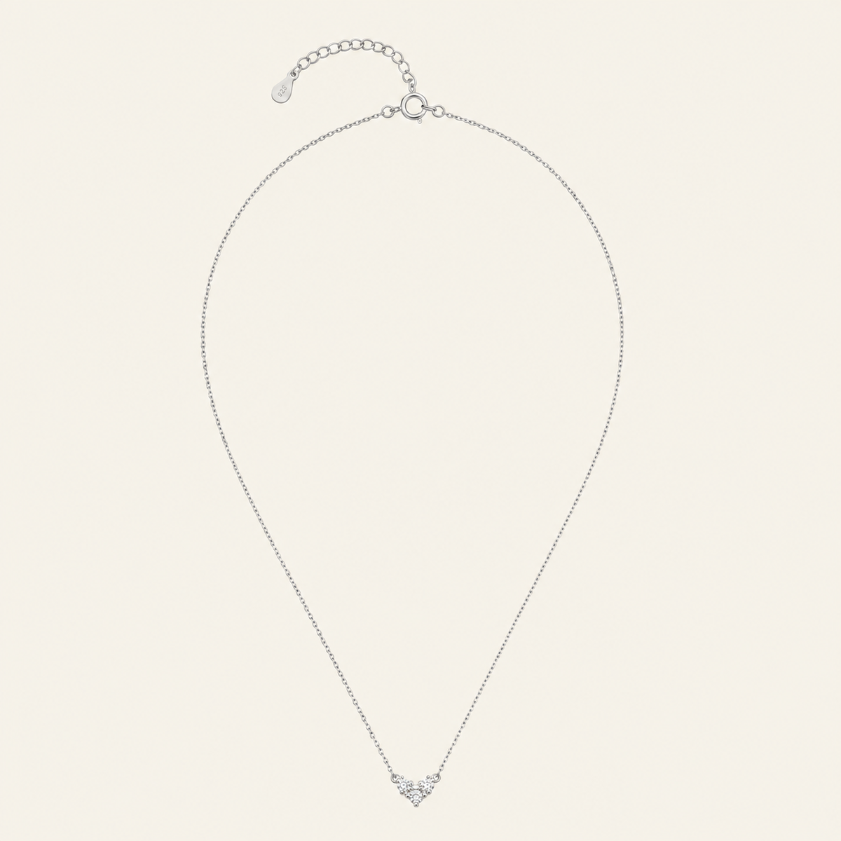 Fine Trio Necklace with a small triangular cluster of clear stones in silver finish