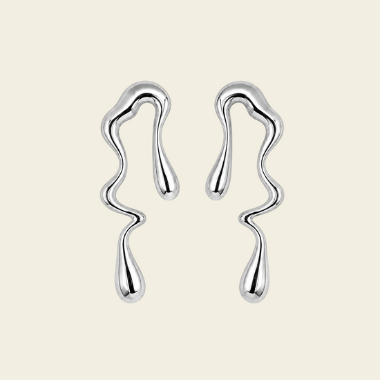 Flowing Line Earrings with flowing open shapes and small hanging drops in silver finish