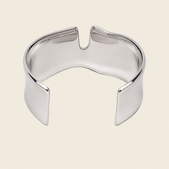 Fluid Edge Cuff with a broad polished open band with notched edges in gold finish
