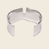 Fluid Edge Cuff with a broad polished open band with notched edges in gold finish