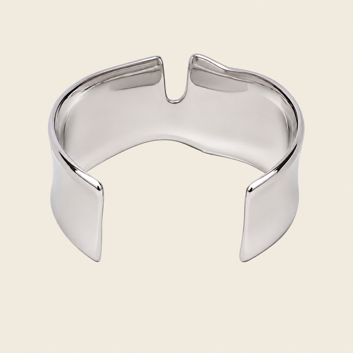 Fluid Edge Cuff with a broad polished open band with notched edges in gold finish
