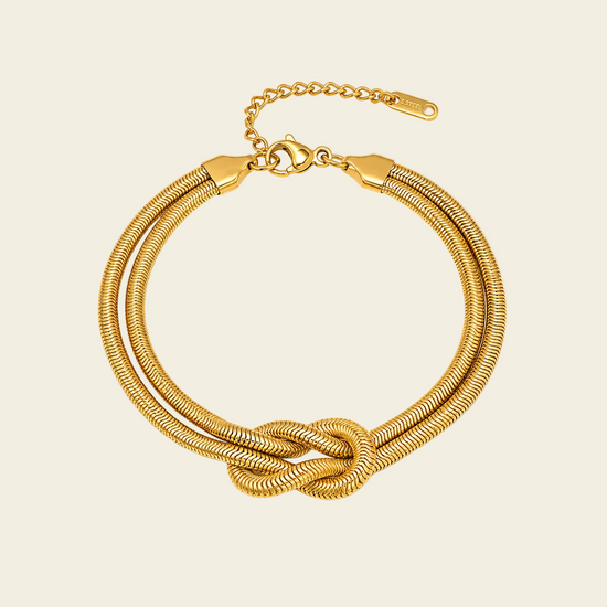 Fluid Knot Bracelet with a double strand and central knot in gold finish