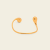 Fluid Teardrop Cuff with an open band with unequal teardrop ends in gold finish