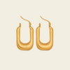 Fluted Arc Earrings with elongated rectangular hoops with ridged surfaces in gold finish