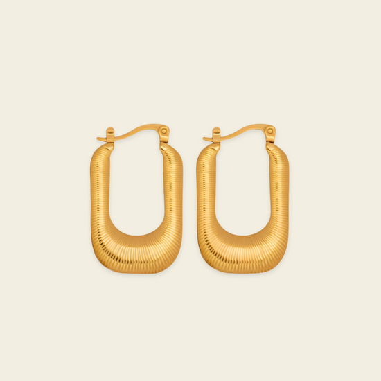 Fluted Arc Earrings with elongated rectangular hoops with ridged surfaces in gold finish