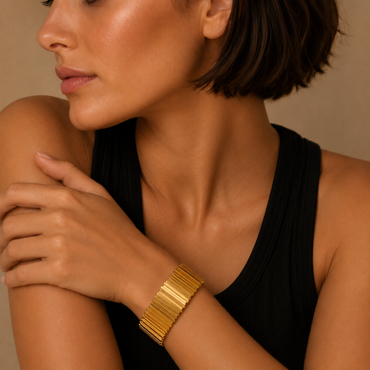 Fluted Ridge Bangle worn on the wrist in gold finish