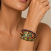 Forest Mosaic Bracelet worn on the wrist, with a green mosaic-patterned oval centre and layered beads