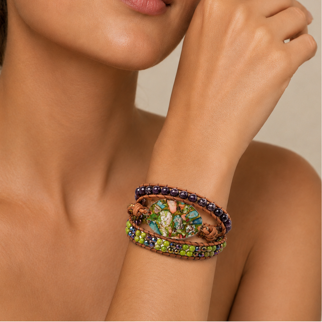 Forest Mosaic Bracelet worn on the wrist, with a green mosaic-patterned oval centre and layered beads