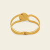Framed Orb Bangle with an open frame and polished spherical centre in gold finish