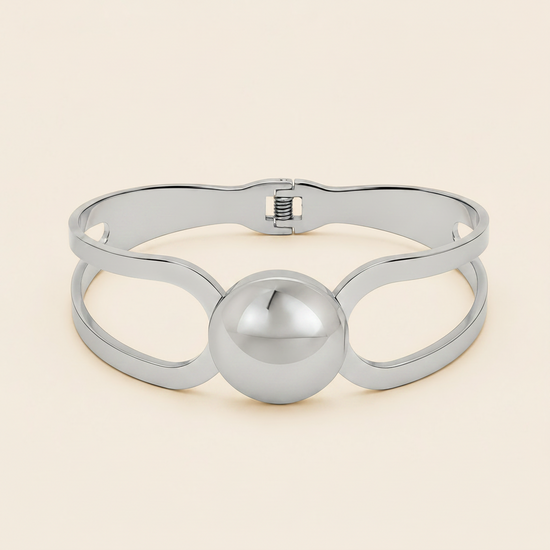 Framed Orb Bangle with an open frame and polished spherical centre in silver finish