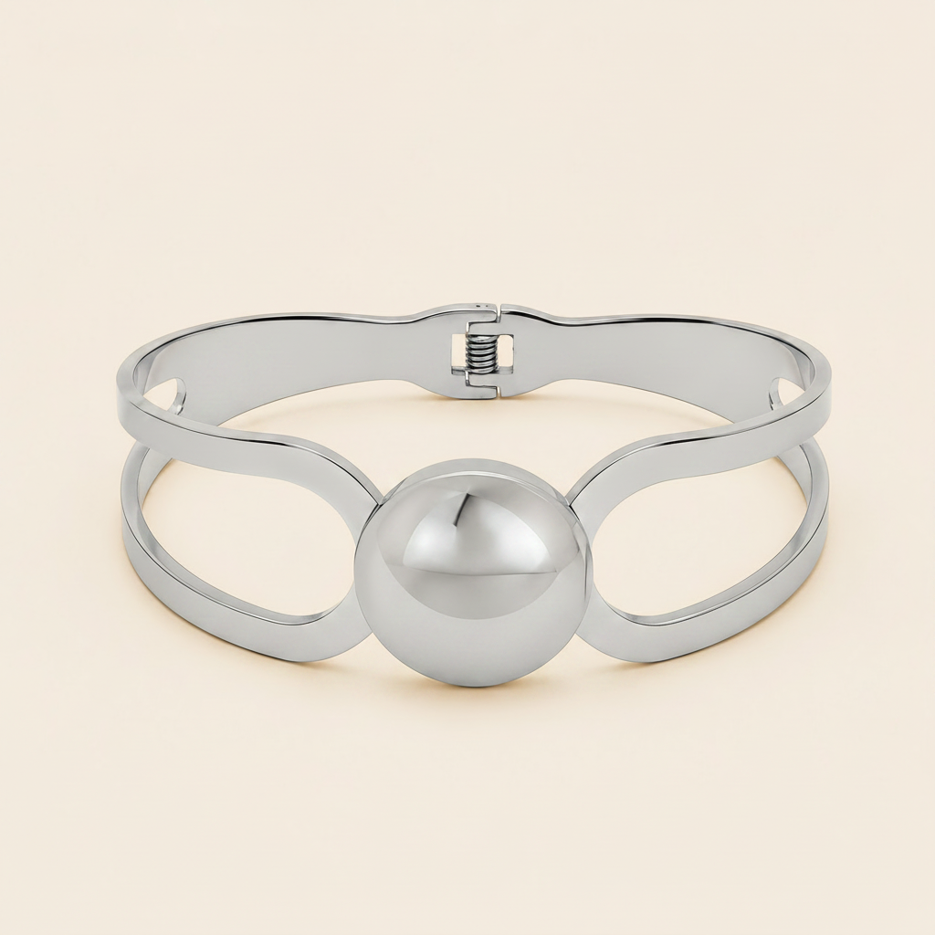 Framed Orb Bangle with an open frame and polished spherical centre in silver finish
