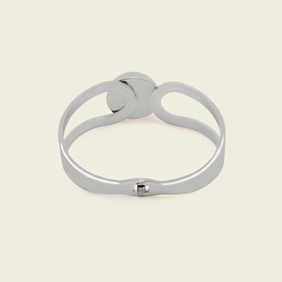 Framed Orb Bangle with an open frame and polished spherical centre in silver finish