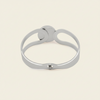 Framed Orb Bangle with an open frame and polished spherical centre in silver finish