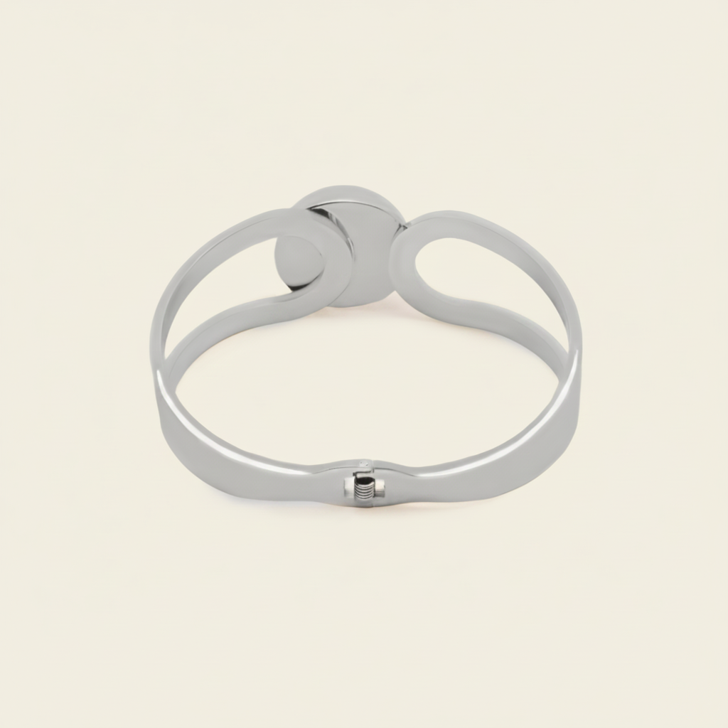 Framed Orb Bangle with an open frame and polished spherical centre in silver finish