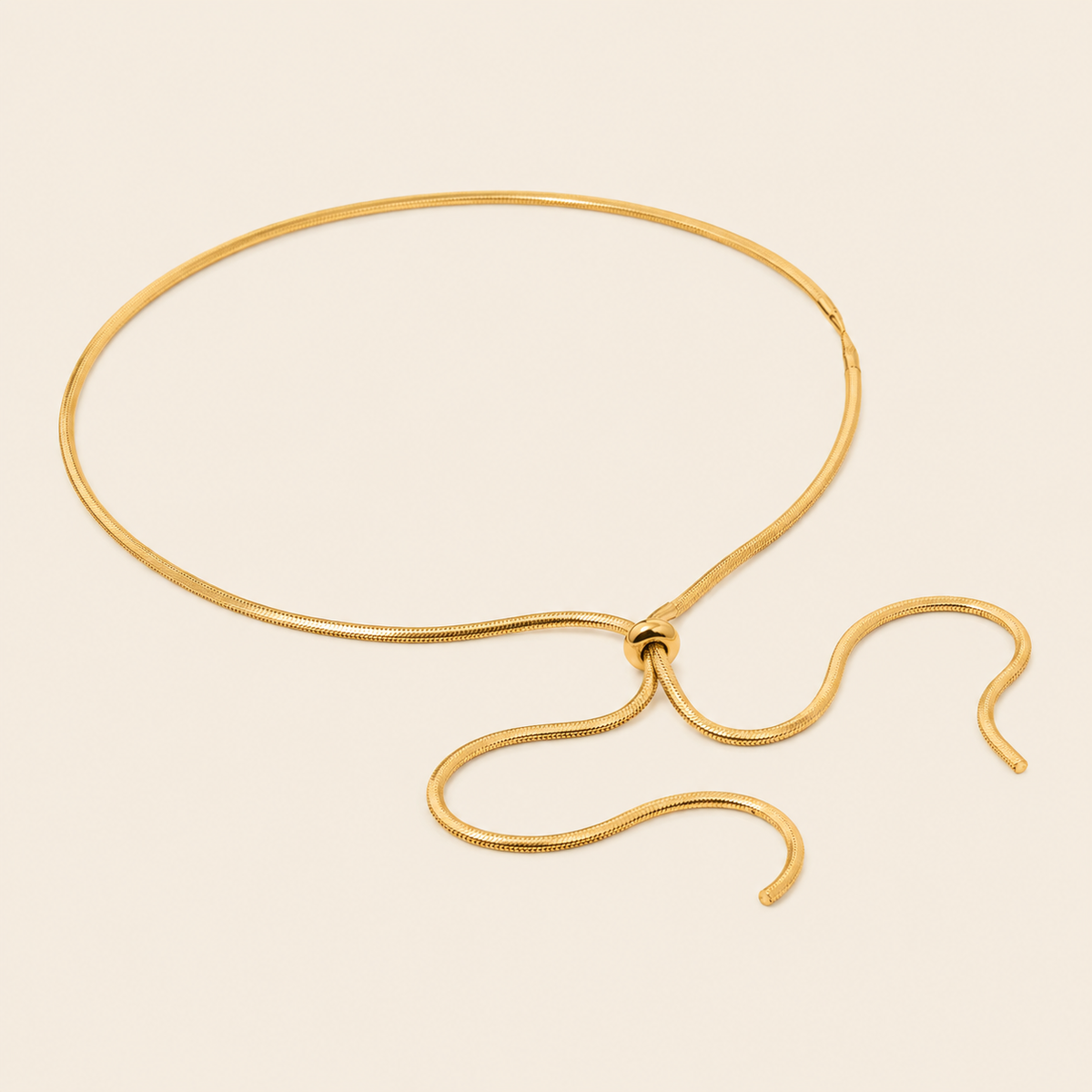Glide Drop Necklace with a smooth collar with a flowing lariat drop in gold finish