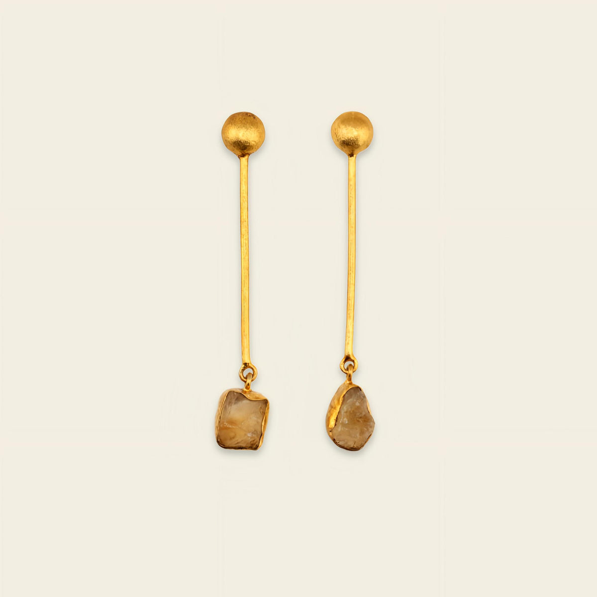 Golden Ease Earrings with slender gold-coloured stems with small amber-coloured drops