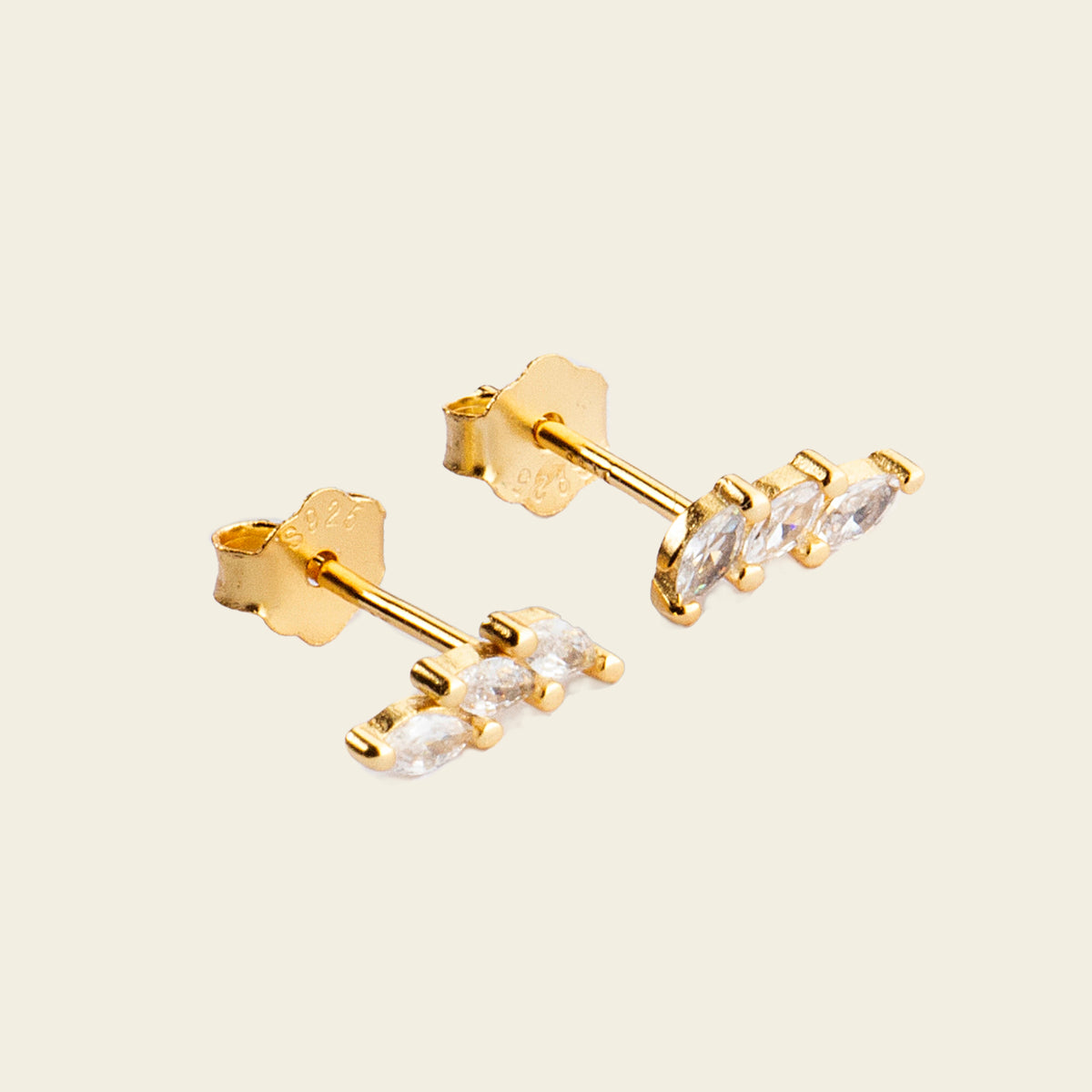 Grace Line Earrings with slender curved bars with clear stone accents in gold finish