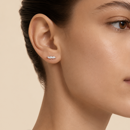 Grace Line Earrings worn on the ear in gold finish