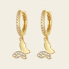 Grace Wing Earrings with butterfly charms suspended from small hoops in gold finish