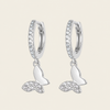 Grace Wing Earrings with butterfly charms suspended from small hoops in silver finish