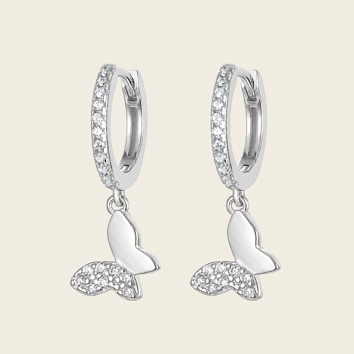 Grace Wing Earrings with butterfly charms suspended from small hoops in silver finish