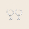 Grace Wing Earrings with butterfly charms suspended from small hoops in silver finish