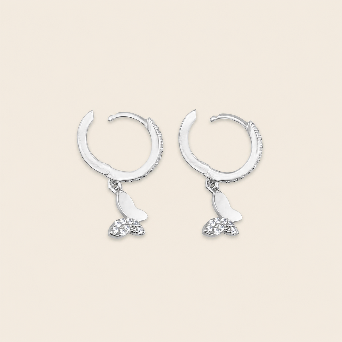 Grace Wing Earrings with butterfly charms suspended from small hoops in silver finish