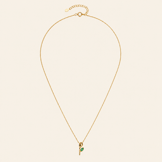 Green Bloom Necklace with a slender stem pendant and green leaf-shaped stone in gold finish