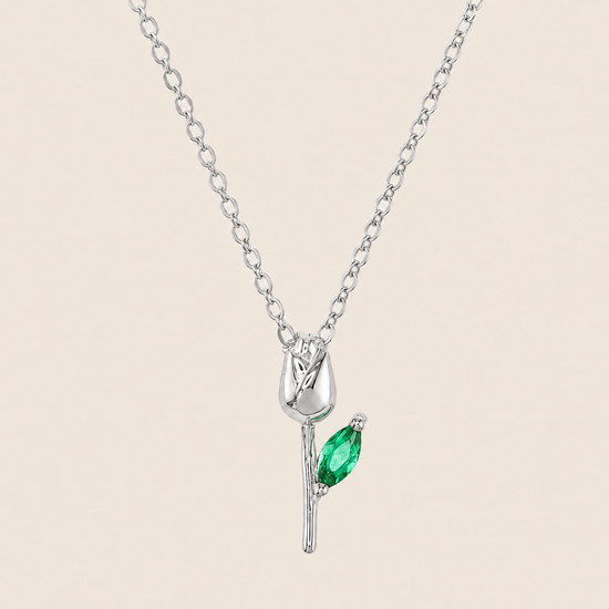 Green Bloom Necklace with a slender stem pendant and green leaf-shaped stone in silver finish