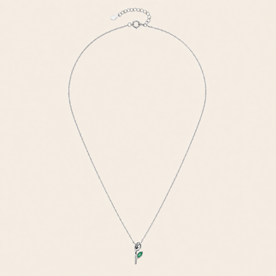 Green Bloom Necklace with a slender stem pendant and green leaf-shaped stone in silver finish
