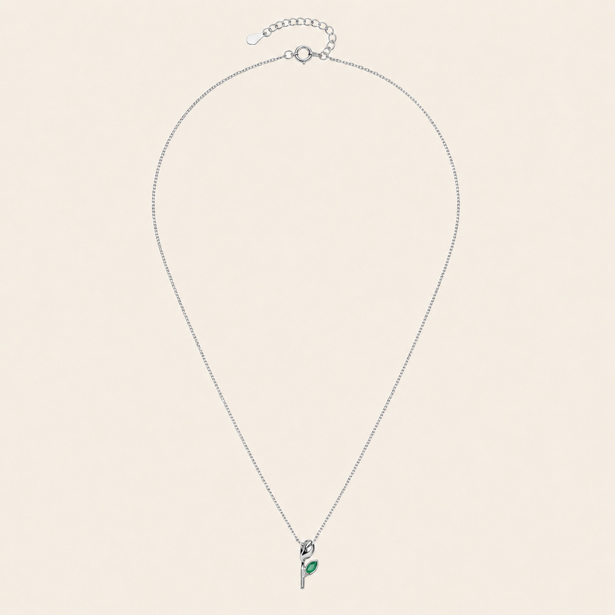 Green Bloom Necklace with a slender stem pendant and green leaf-shaped stone in silver finish