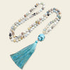 Harbour Mala Necklace with pale stone beads and a turquoise-coloured tassel
