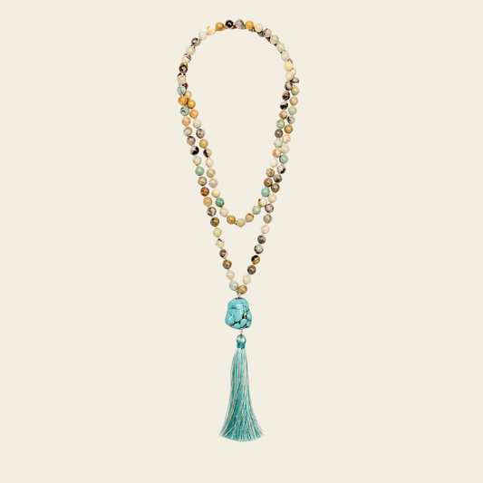 Harbour Mala Necklace with pale stone beads and a turquoise-coloured tassel