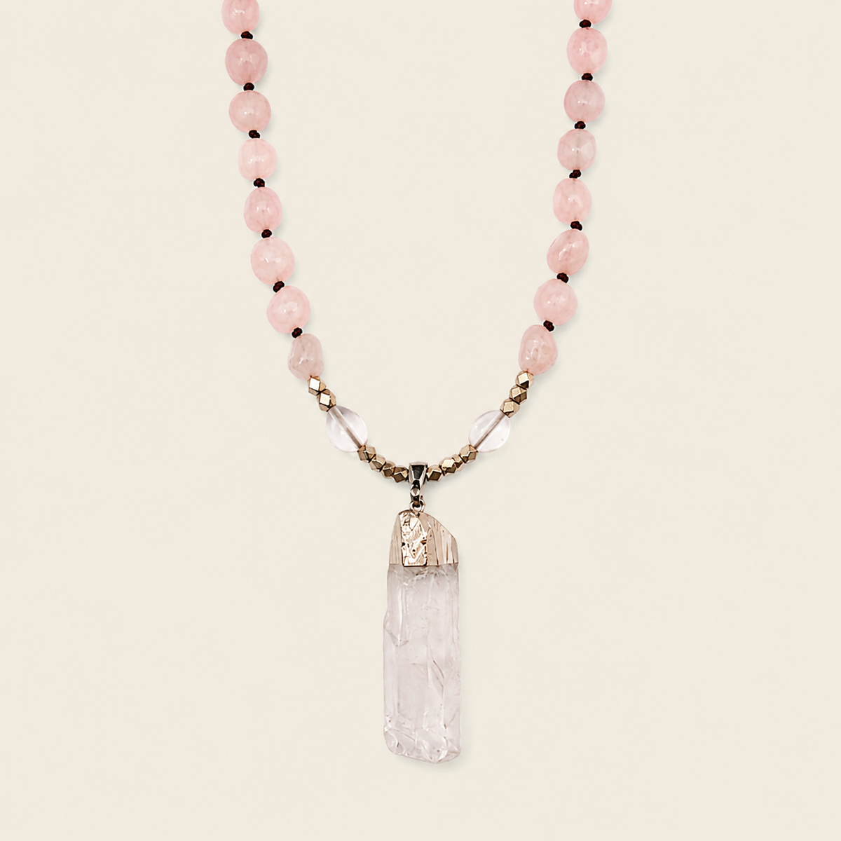 Hushed Point Necklace with pale pink beads and a translucent pointed pendant