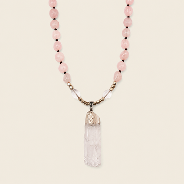 Hushed Point Necklace with pale pink beads and a translucent pointed pendant