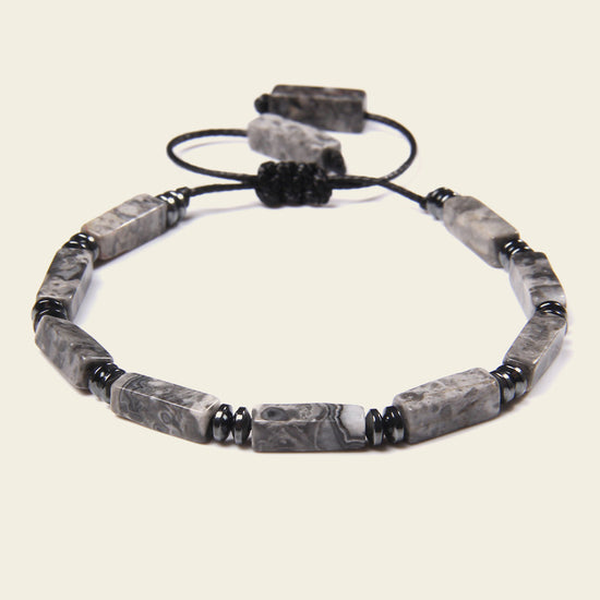 Interval Hold Bracelet with elongated stone beads on an adjustable cord