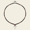 Iron Tide Necklace with dark stone beads and an open triangular pendant