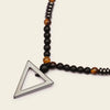 Iron Tide Necklace with dark stone beads and an open triangular pendant
