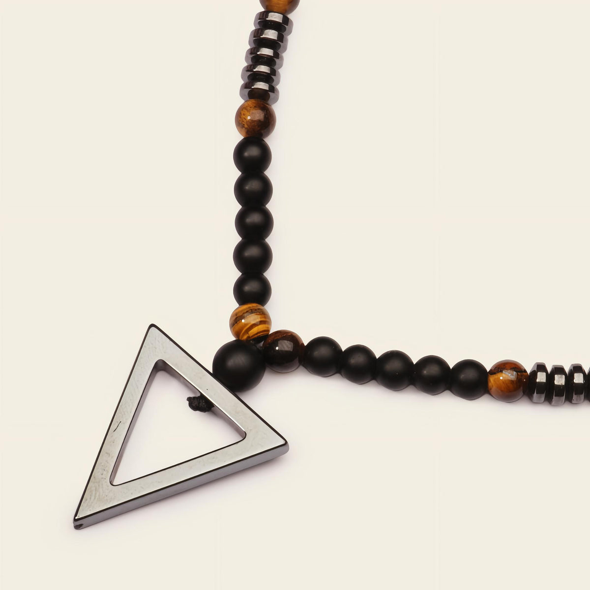 Iron Tide Necklace with dark stone beads and an open triangular pendant