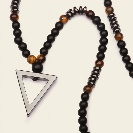 Iron Tide Necklace with dark stone beads and an open triangular pendant