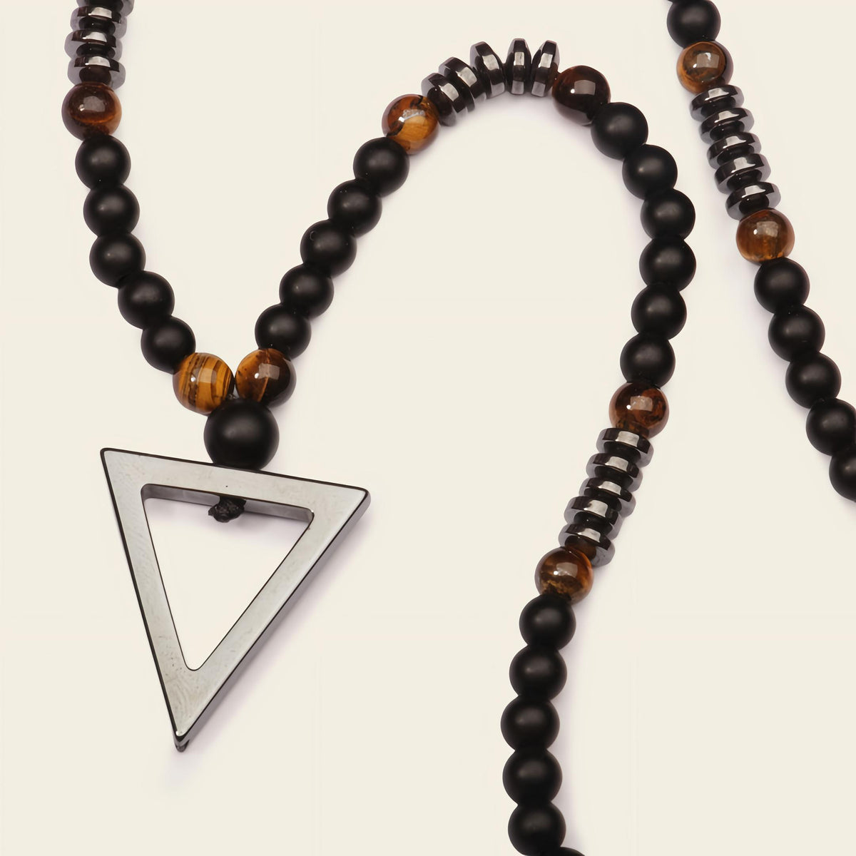 Iron Tide Necklace with dark stone beads and an open triangular pendant