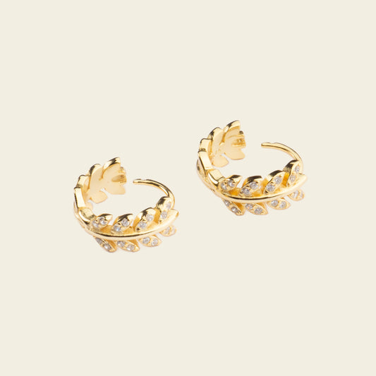 Laurel Arc Earrings with small hoops with leaf-shaped details in gold finish