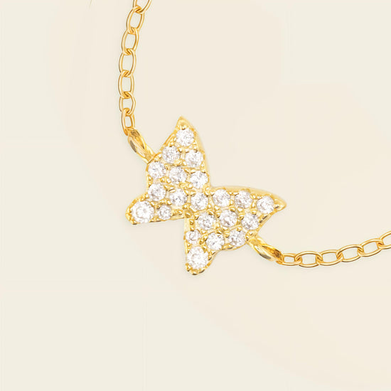 Light Wing Ring with a butterfly motif on a fine chain band in gold finish