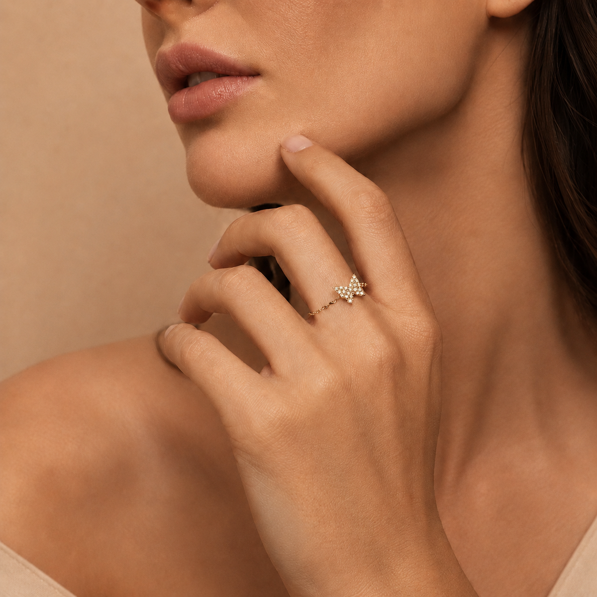 Light Wing Ring worn on the hand in gold finish