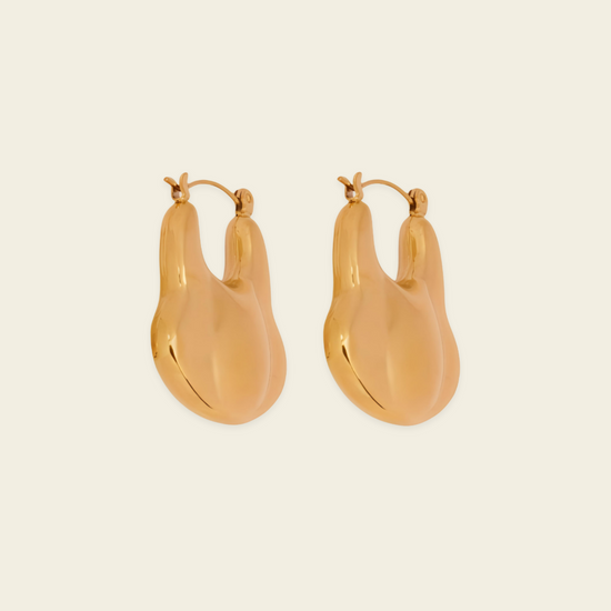 Liquid Loop Earrings with broad polished irregular hoop shapes in gold finish