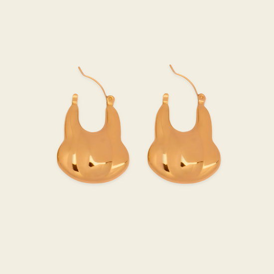 Liquid Loop Earrings with broad polished irregular hoop shapes in gold finish