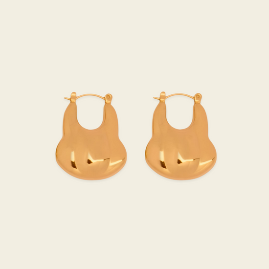 Liquid Loop Earrings with broad polished irregular hoop shapes in gold finish